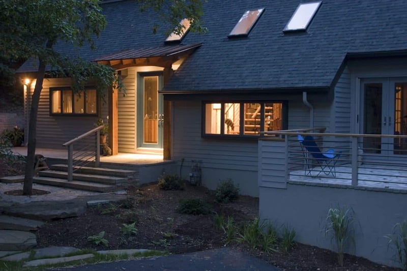 Evening view of a remodeled historic home exterior by Villa Builders in Central Maryland