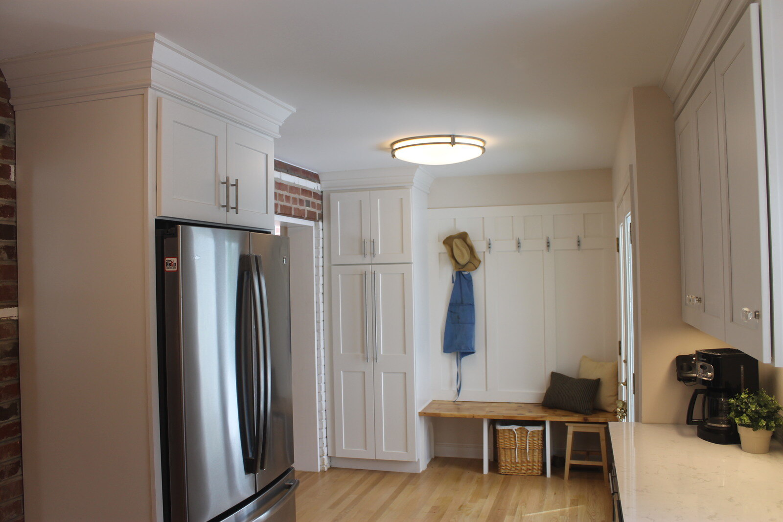 Spacious kitchen remodel with stainless steel appliances and a cozy seating area by Villa Builders in Annapolis, MD