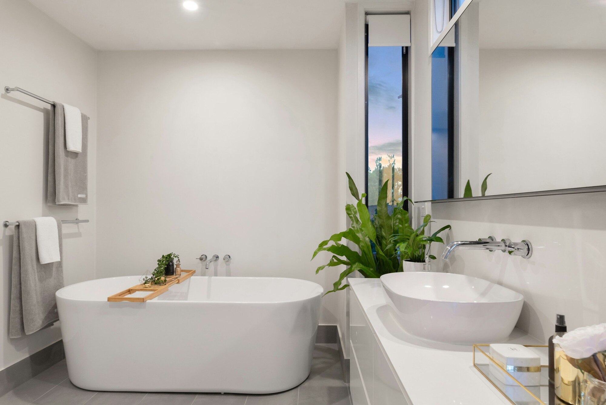 Modern bathroom renovation featuring a freestanding tub and elegant vanity by Villa Builders in Southern Maryland