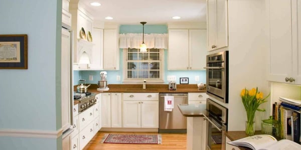 Kitchen remodel in Calvert County, MD with white cabinets and granite countertops