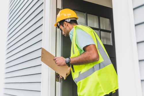 Image of an official inspecting a home in Calvert County, Maryland
