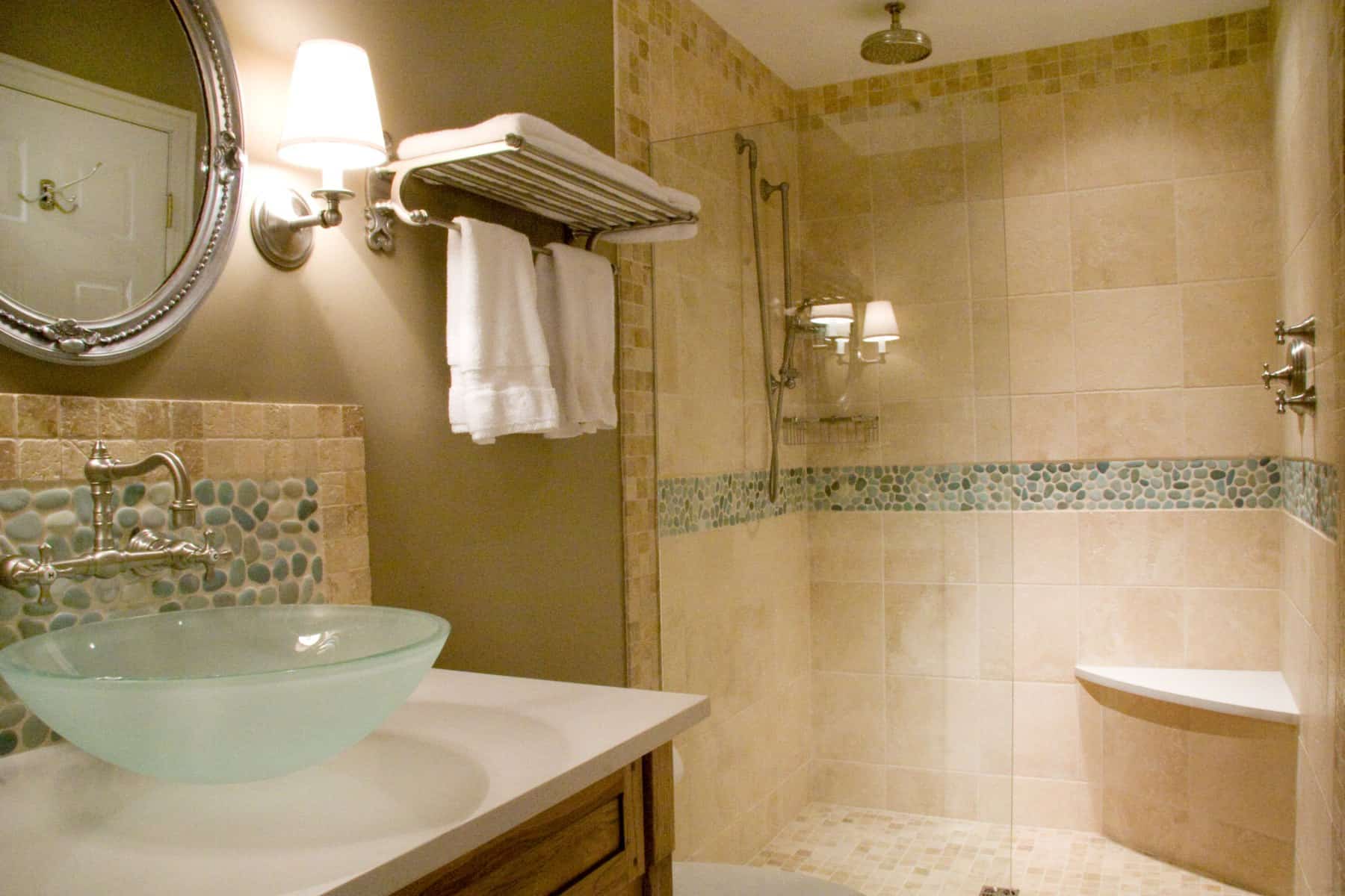 Central Maryland bathroom renovation by Villa Builders with a stylish glass sink