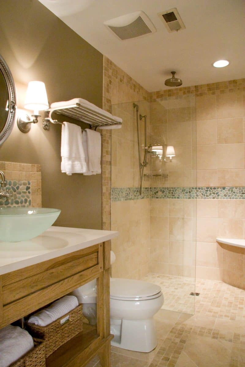 Elegant bathroom by Villa Builders featuring glass sink in Annapolis, Maryland