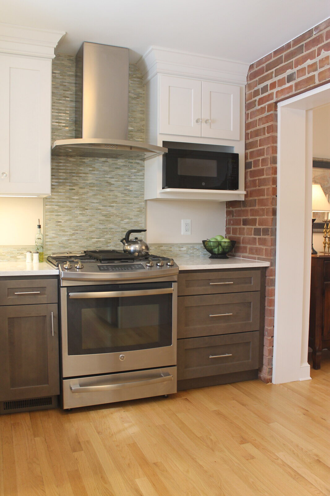 Serene bathroom remodel with bright lighting and polished wood vanity by Villa Builders in Annapolis, MD